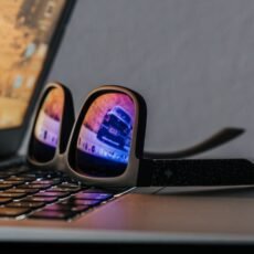 black smartphone on black laptop computer
